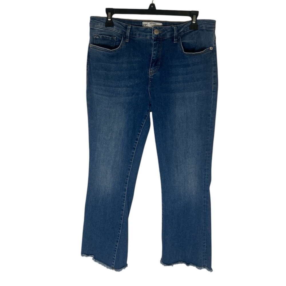 Free People denim bootcut cropped jeans with raw hem
Size 30